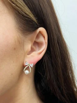 Earrings*SVNX Studded Bow Earrings with Hanging Pearl in Gold
